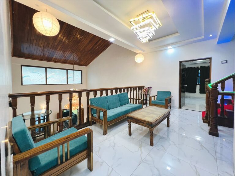 Megh Villa, Alibag: The lounge beside the stair railing