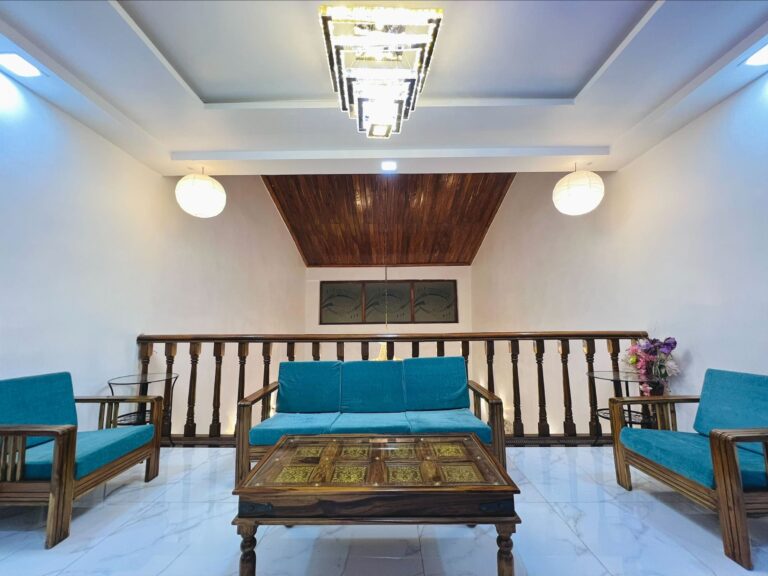 Megh Villa, Alibag: The lounge, with sofas around a carved coffee table