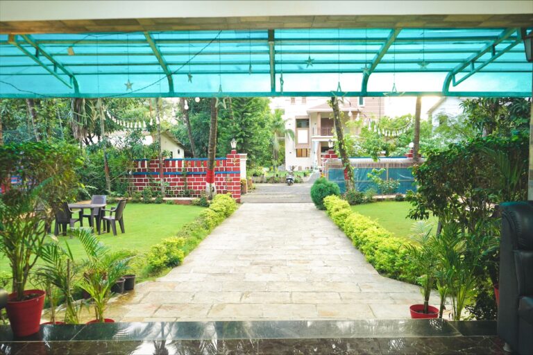 Megh Villa, Alibag: The garden path to the gate, from under the porch canopy