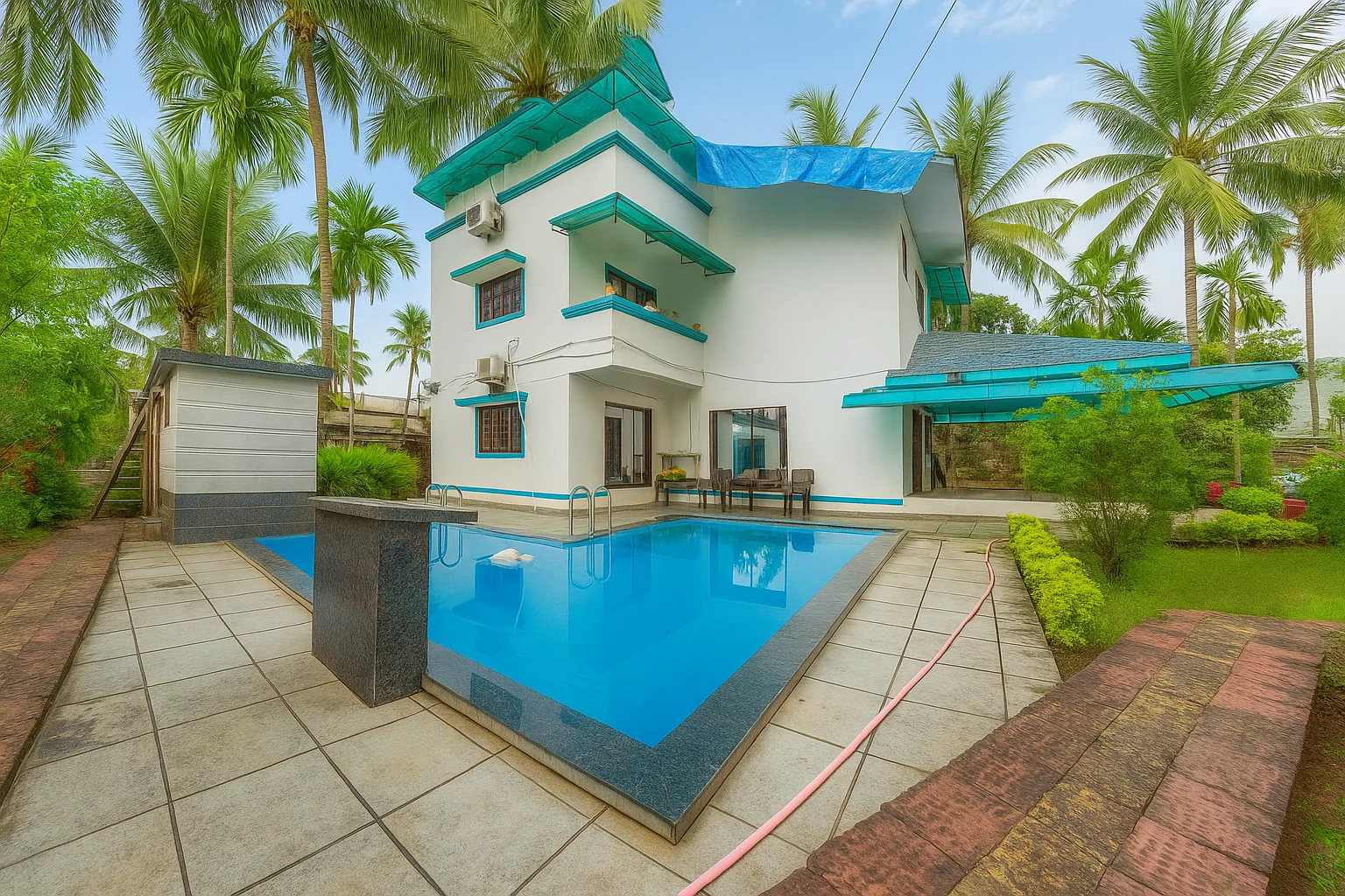 Megh Villa exterior with laterite pillars and palms